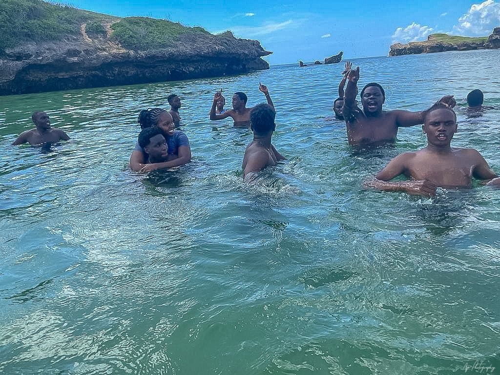 Young people swimming together in the sea
