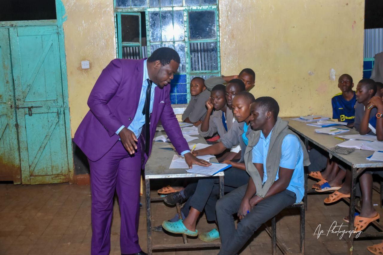 Nelson speaking with students at their desks during a classroom session
