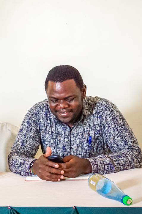 Nelson smiling at an alumni meeting