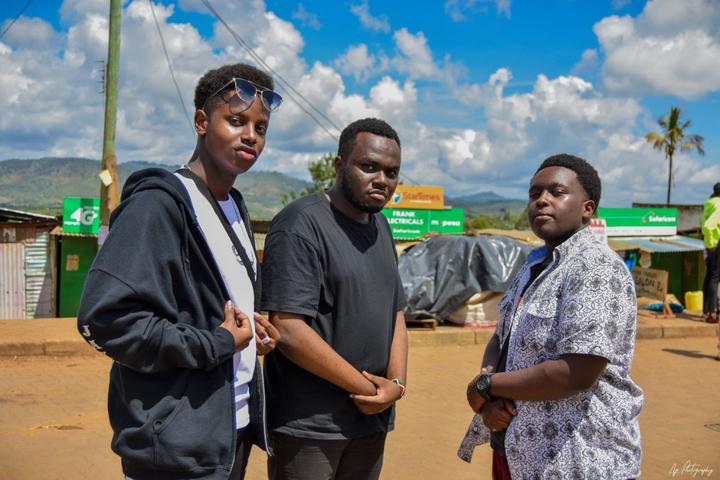 Three young people posing together outdoors on the trip