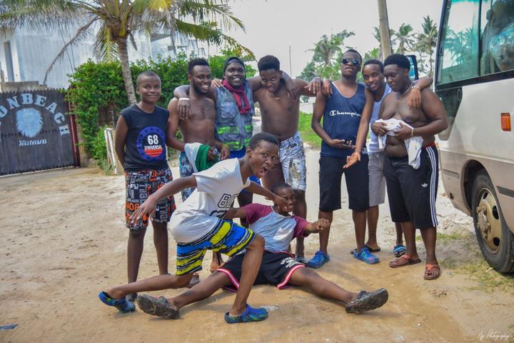 Mentees posing together outdoors at the coast