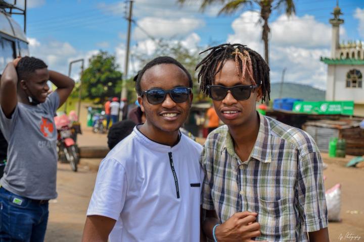 Young people in sunglasses posing together