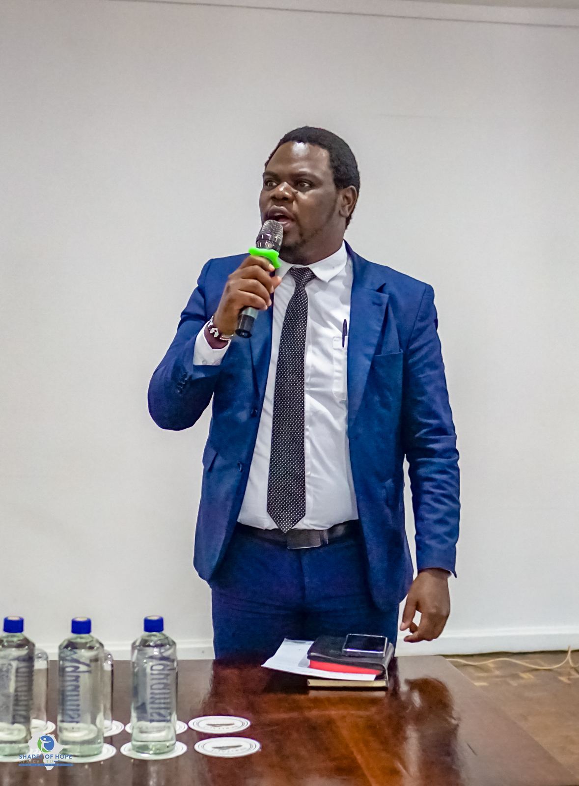 Nelson Gitonga, known as Mentor Rambez, speaking at a community event